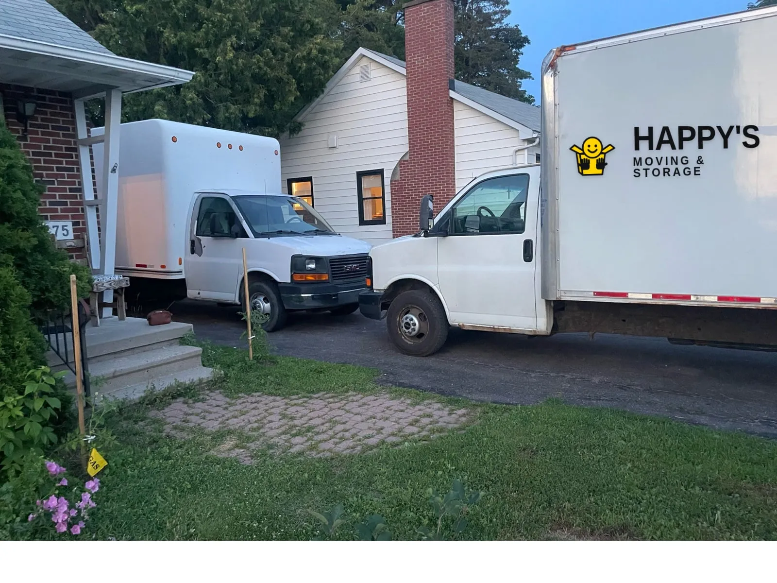 Happy's Moving & Storage branded box truck parked on an Ottawa Valley driveway